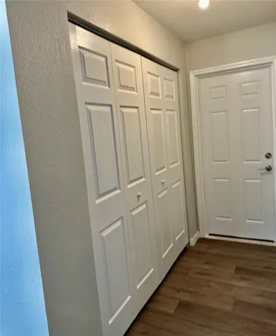 Hallway leading to double garage