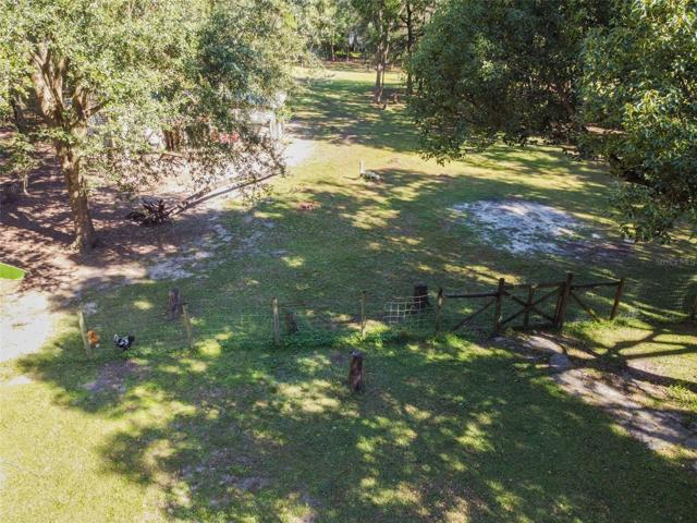 Fence line separating house from backyard