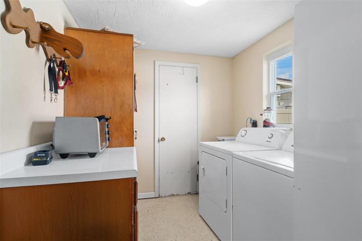 Laundry Room with Washer & Dryer and Cabinet Storage