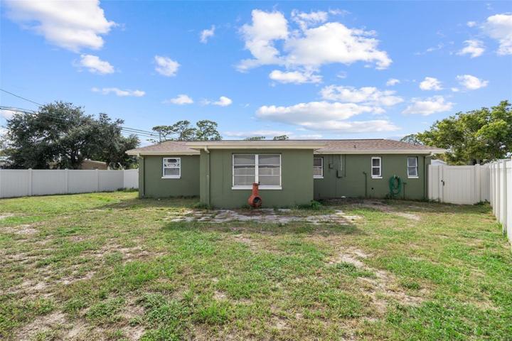 Rear of Home with Vinyl Fenced Yard