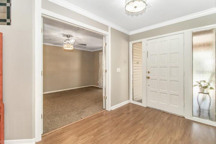 formal dining area to the right of the foyer that is versatile and could be used as a den/office/guest room if desired.