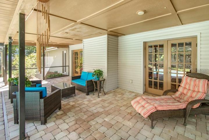 Large screened pool with sitting area