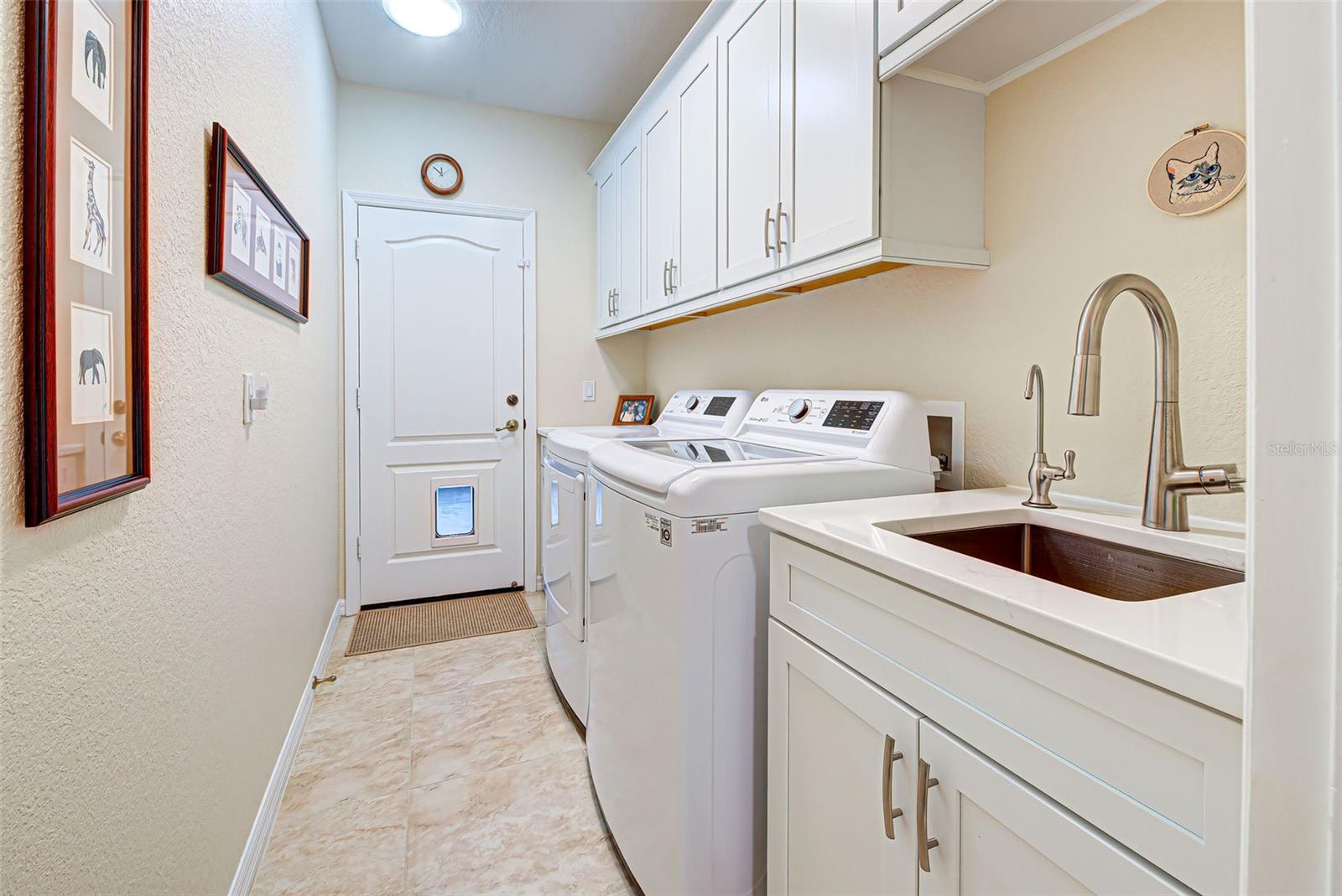 Laundry Room with utility sink and lots of storage