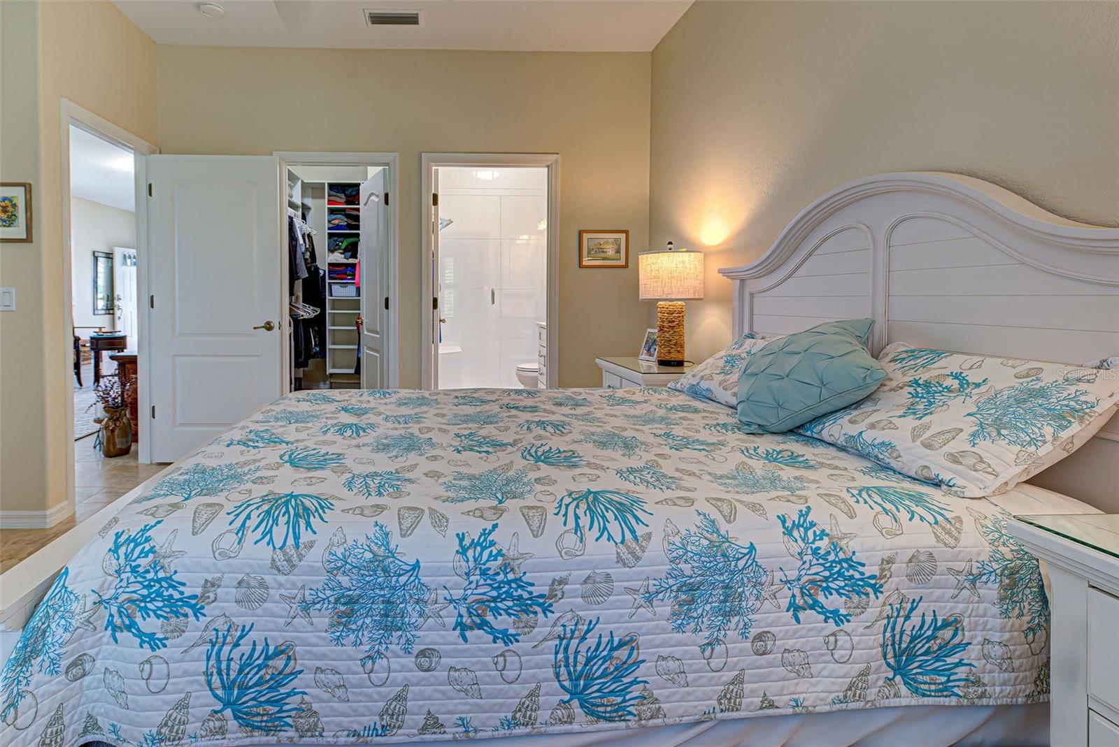 Custom closet and renovated ensuite bath in primary bedroom