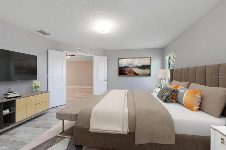 This photo has been virtually staged. A haven of comfort, accessible through double doors and boasting a generously sized walk-in closet.