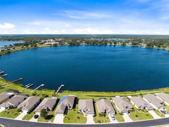 Aerial view of the front of home with Lake Sears in the background.