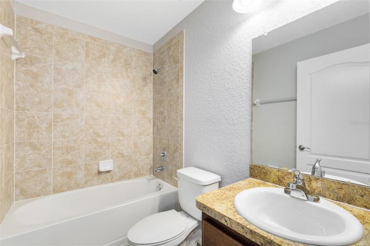 Full secondary bath with a tub/shower combo.