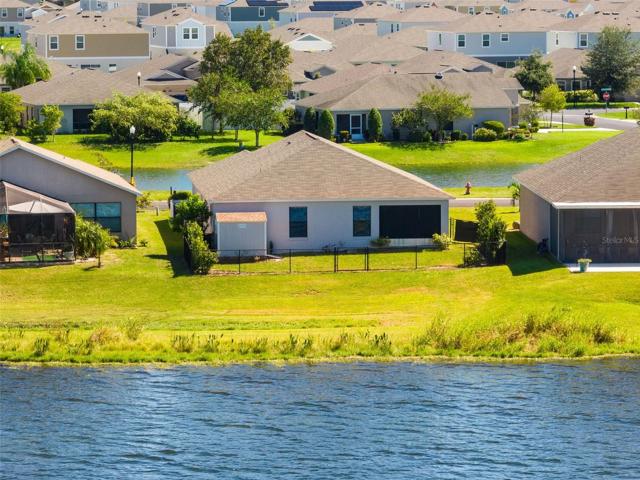 Rear exterior view of the home from the lake.