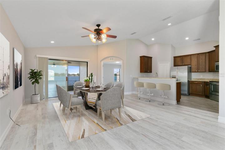 This photo has been virtually staged. Your kitchen is adjacent to the dining area.