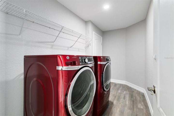 . The convenience of a separate laundry room with garage access adds to the practicality of this home.