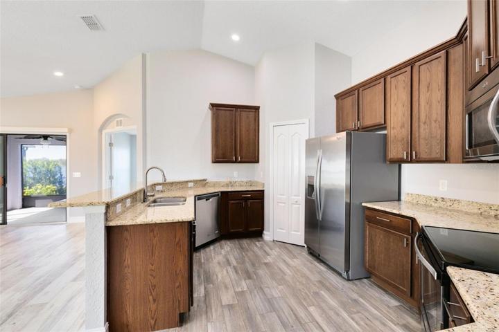 Featuring beautiful granite countertops and breakfast bar, stainless steel appliances, and a convenient closet pantry. Just imagine the delightful meals you can prepare here!