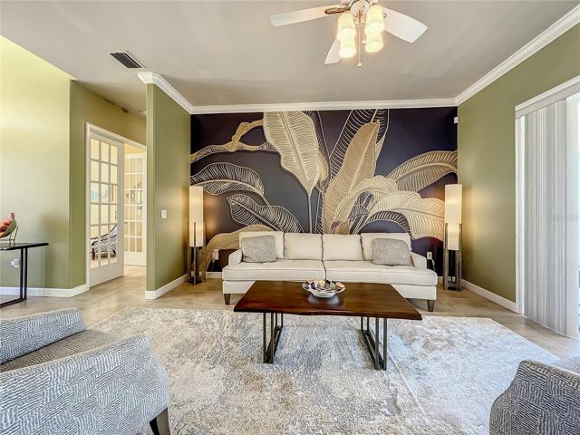 Formal living room with exquisite wall design.