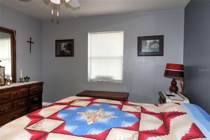 with ceiling fan & laminate floors....
