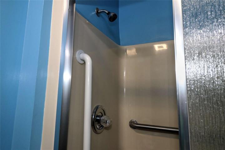 with shower with safety hand rails!