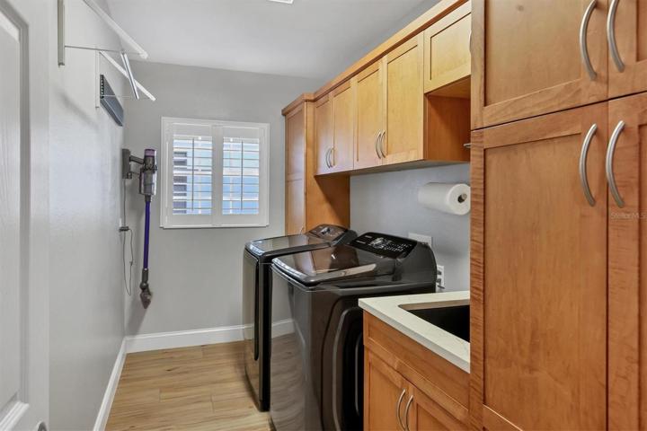 Laundry Rm w/maple cabinets& Blanco sink