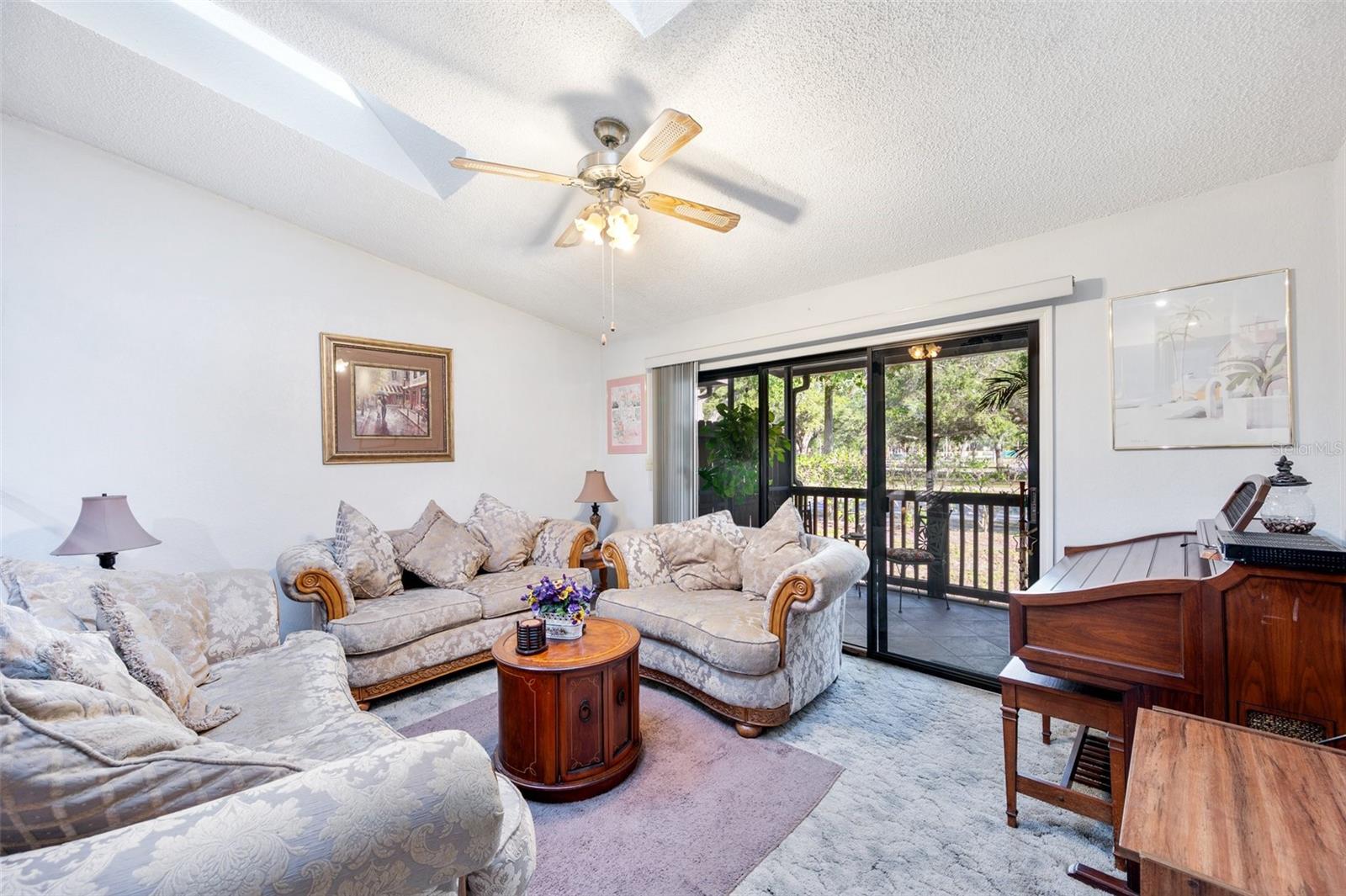 Spacious Living room leading out to back patio