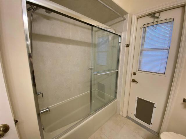 Guest bath with door leading to the pool deck