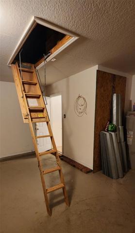 Attic Access Stairs, Metal Hurricane Shutters.