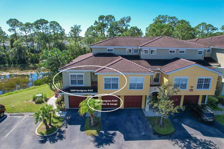 Aerial shows Condo and Pond