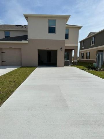 Back view Garage and patio