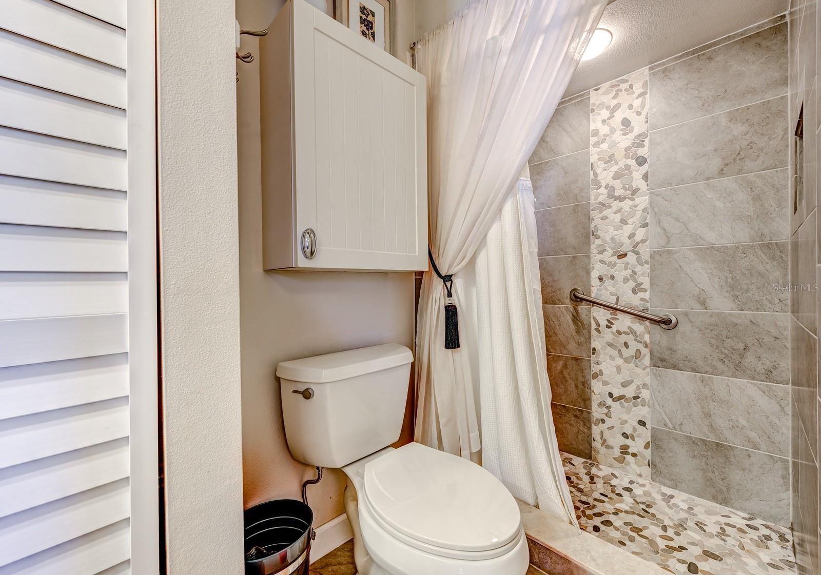 The primary bath has an updated walk-in shower. Both baths have grab bars installed for added comfort. A new water heater was installed in 2020.