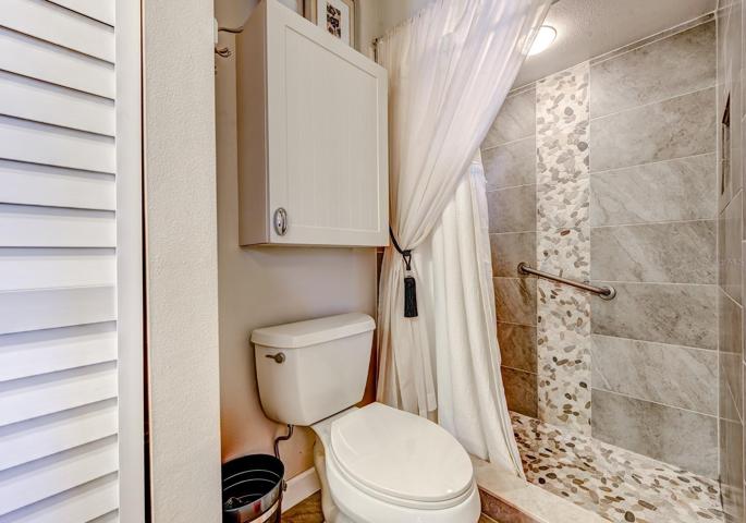 The primary bath has an updated walk-in shower. Both baths have grab bars installed for added comfort. A new water heater was installed in 2020.