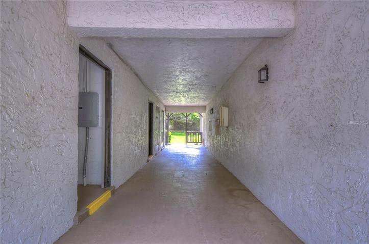 view entering archway, building laundry to the left.