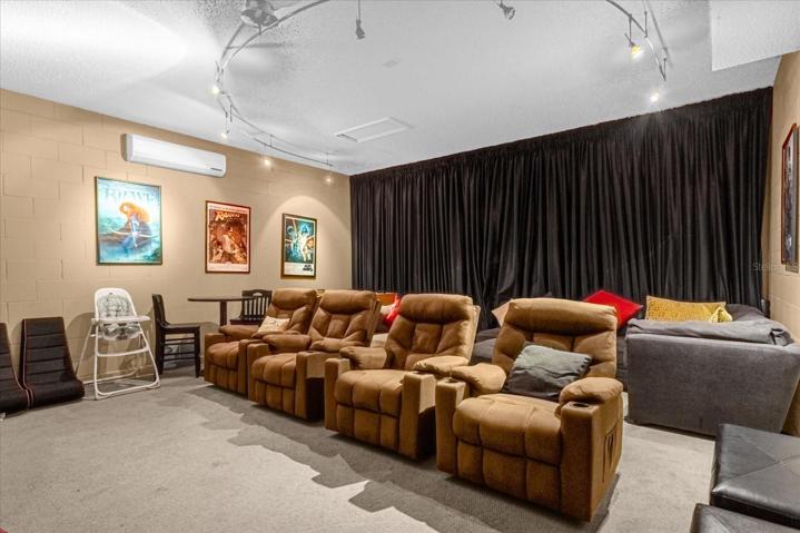 Garage converted to movie theater and game area