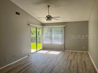 Modern grey paint and vinyl laminate flooring in living room (  Not brown)