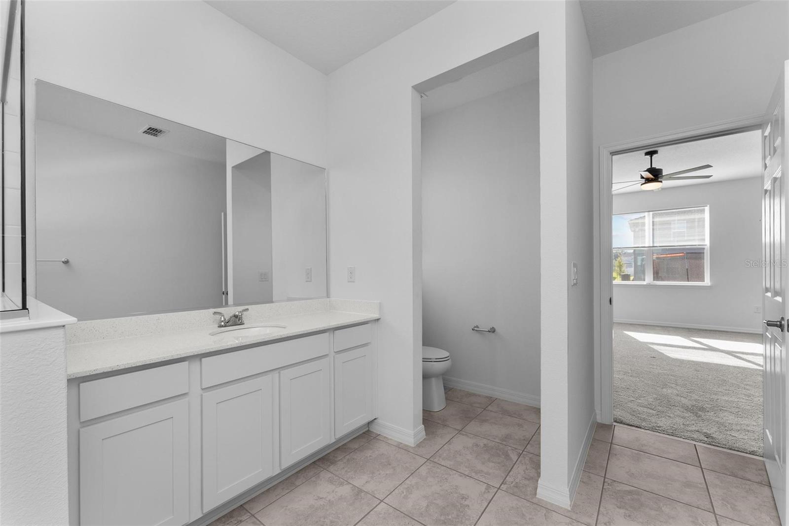Primary bathroom w/ dual sinks and large shower