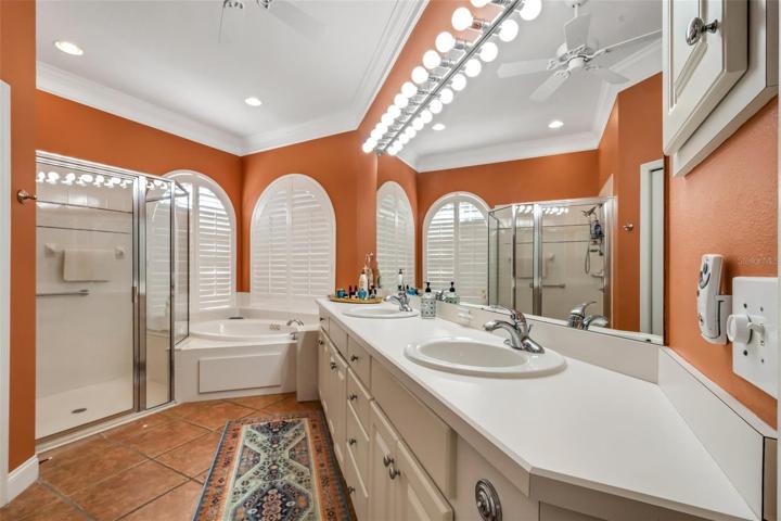 En-suite master bathroom features an extra long 2 sink vanity with plenty of storage.