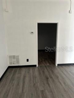 View into storage/rear entrance/bath