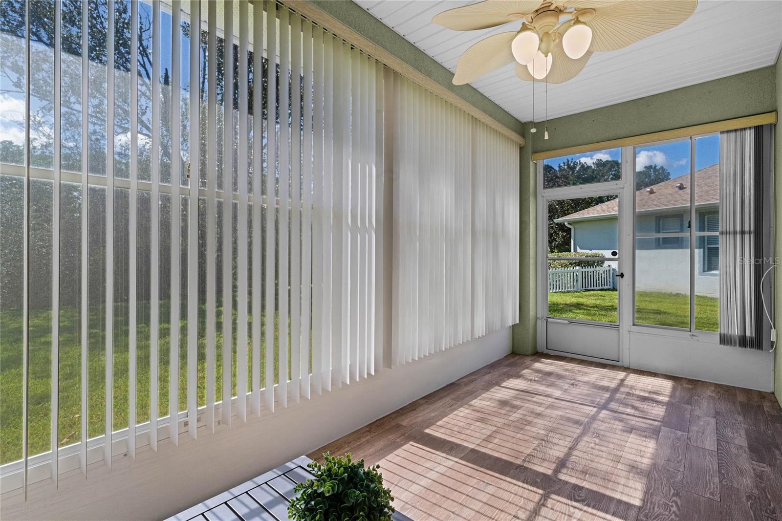 Enclosed covered patio w/ acrylic sliding windows