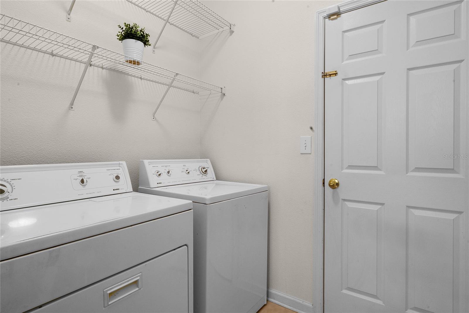 Utility Room w/ washer & dryer