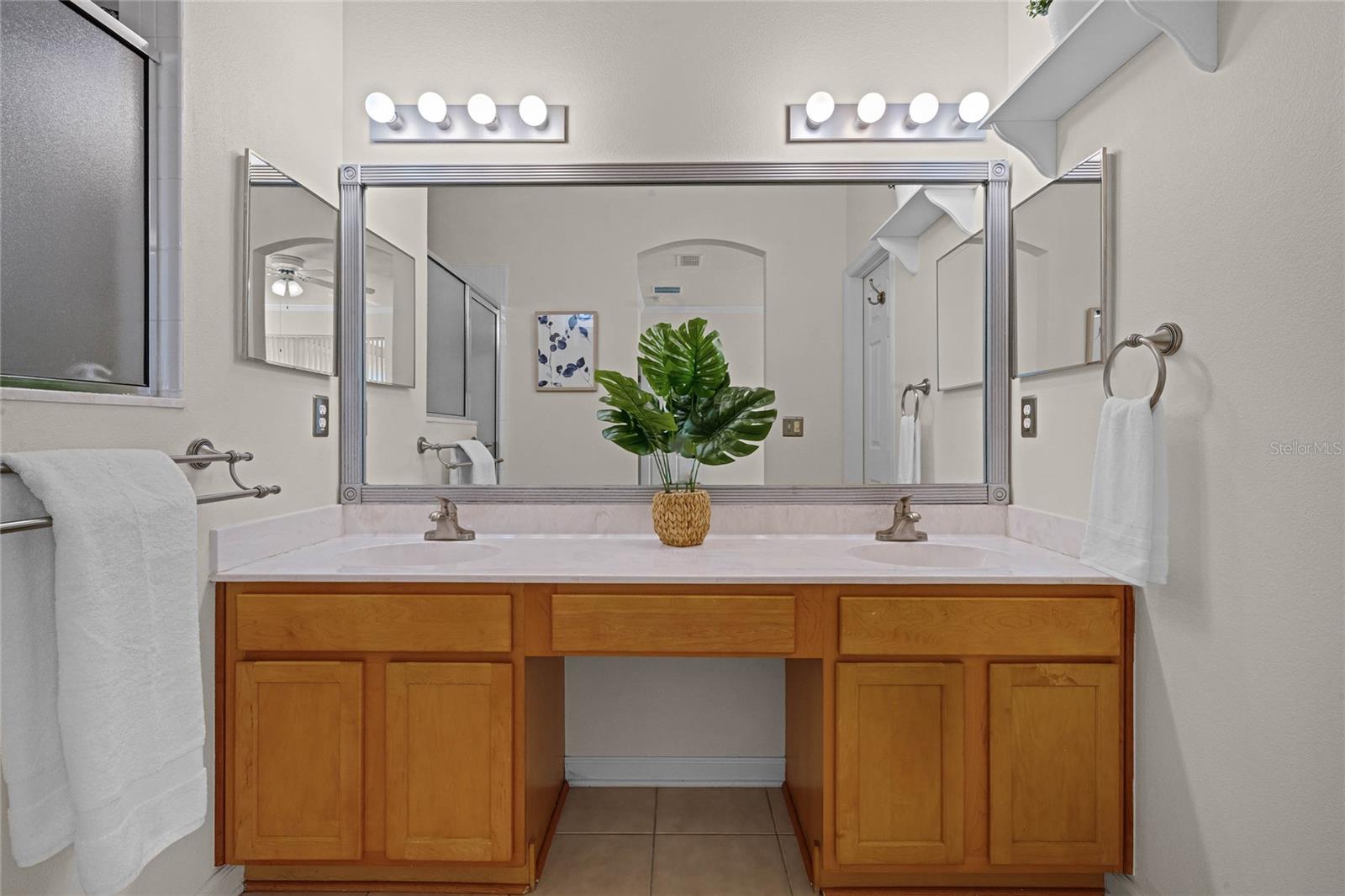 Master Bathroom w/ dual sinks & large walk-in shower w/ grab bars