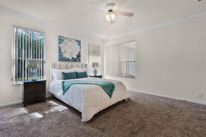 Master Bedroom w/ several windows for natural light