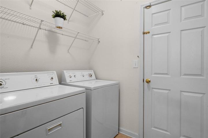 Utility Room w/ washer & dryer