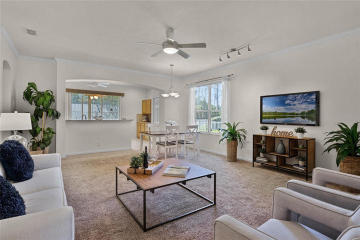 17'6" x 21' Great Room w/ crown molding, ceiling fan & track lighting