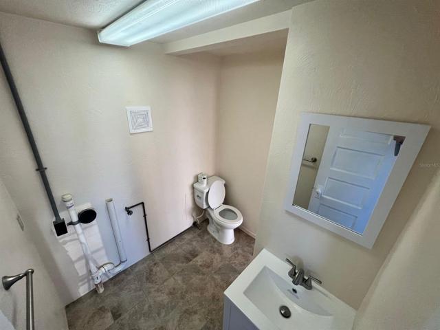 Unit C half bath with washer / dryer hook up.