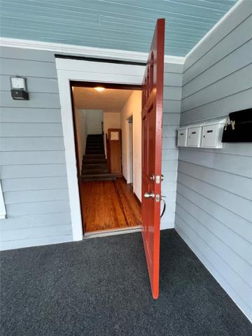Front door with view of new mail boxes