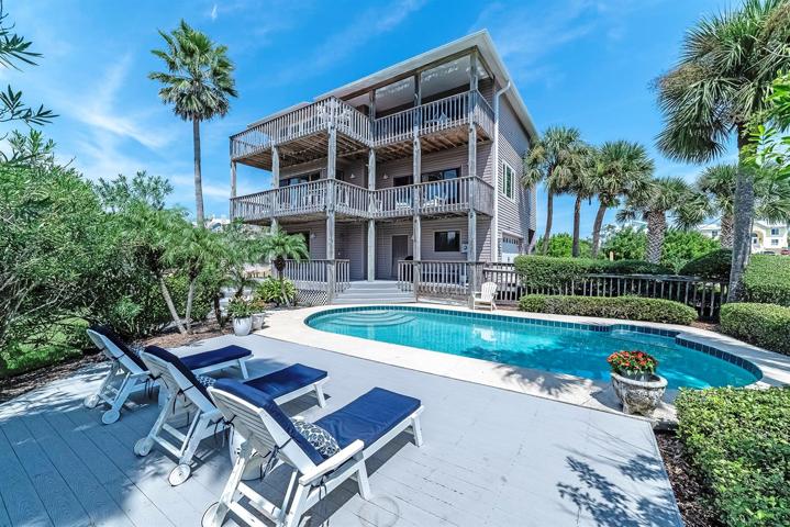 Inground pool with extended wood deck is a lovely spot to sunbathe, entertain or just relax