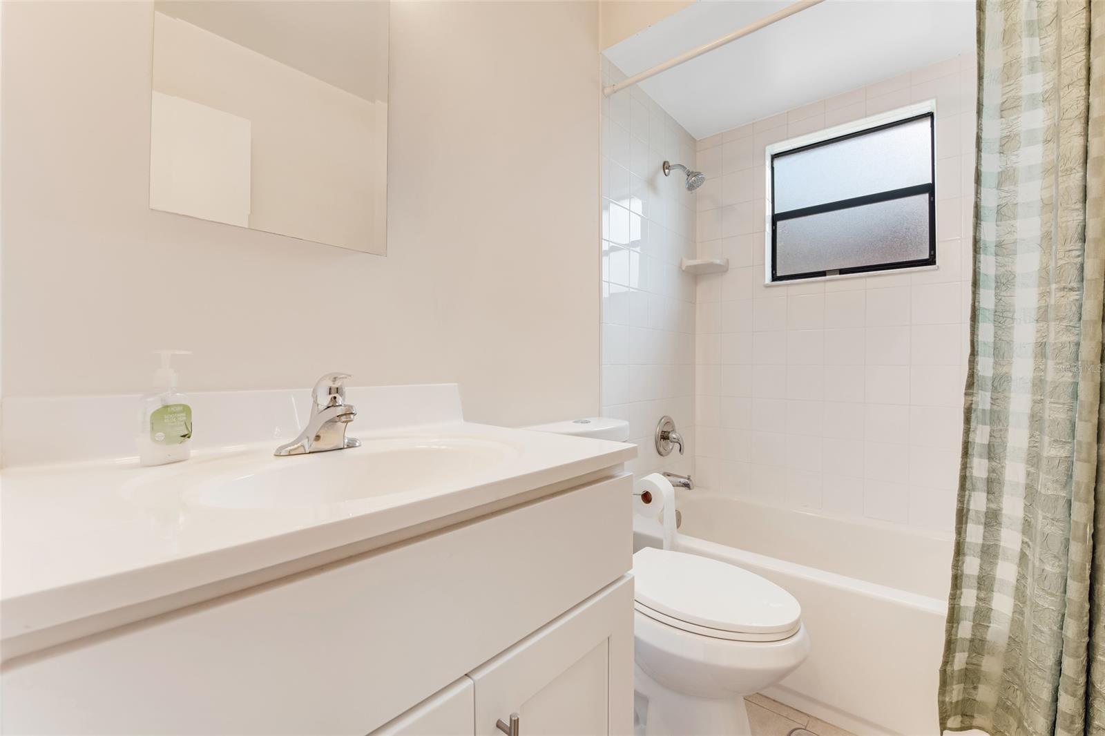 Updated guest bath features tub