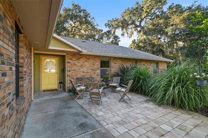 The front porch extends out to include a PAVER PATIO with space for seating when you want to enjoy the view from the front and mingle with your neighbors!