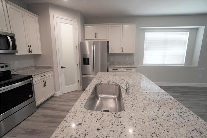 Granite countertops, 42" cabinets, closet pantry and stainless steel appliances