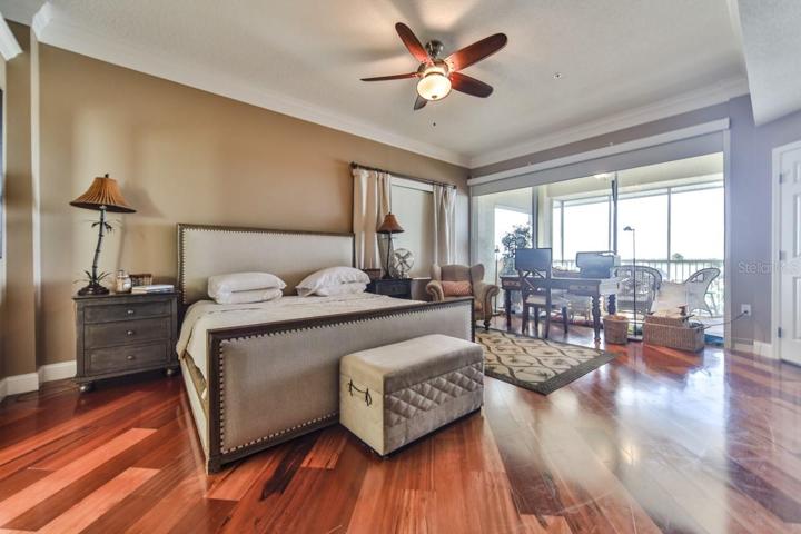 Master bedroom w King bed and access to balcony