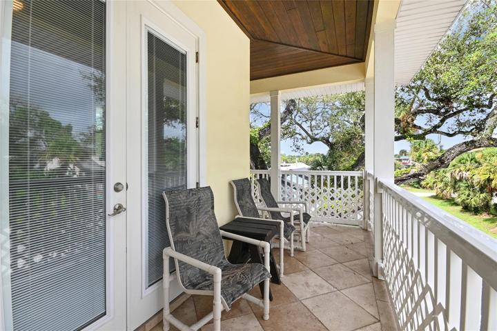 Both upstairs bedrooms connect to a balcony that wraps around the house.