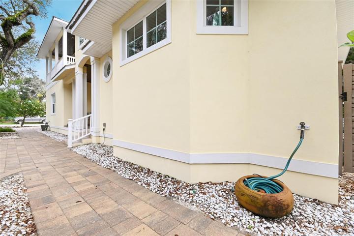 There are multiple hose bibs on each side of the house and even the balcony for easy of use.