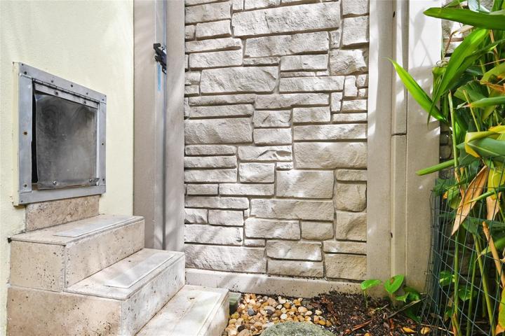 Lockable doggy door from laundry room with doggy steps!