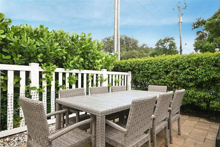 Professional landscaping maximizes privacy while giving plenty of space to entertain both inside and out!
