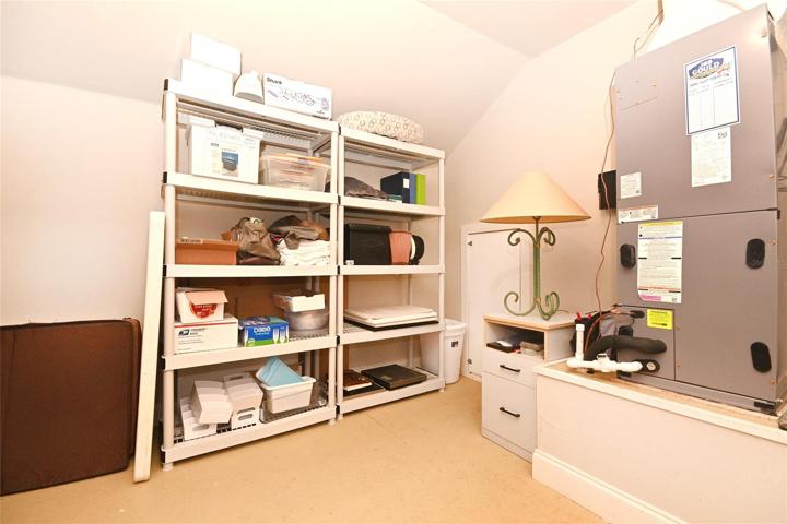 Upstairs attic space under A/C provides even more storage space.